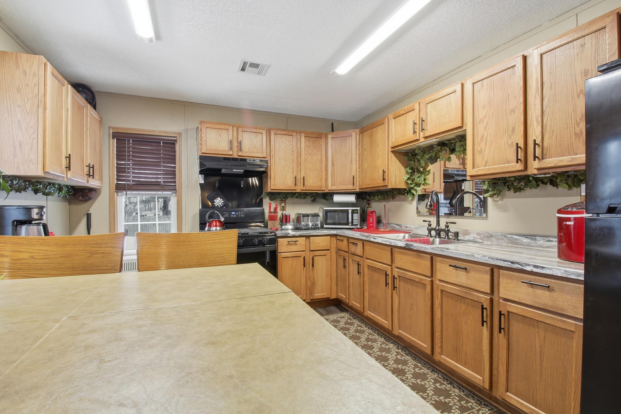 Kitchen with plenty of cabinet storage and generous counter space for everyday cooking and gathering