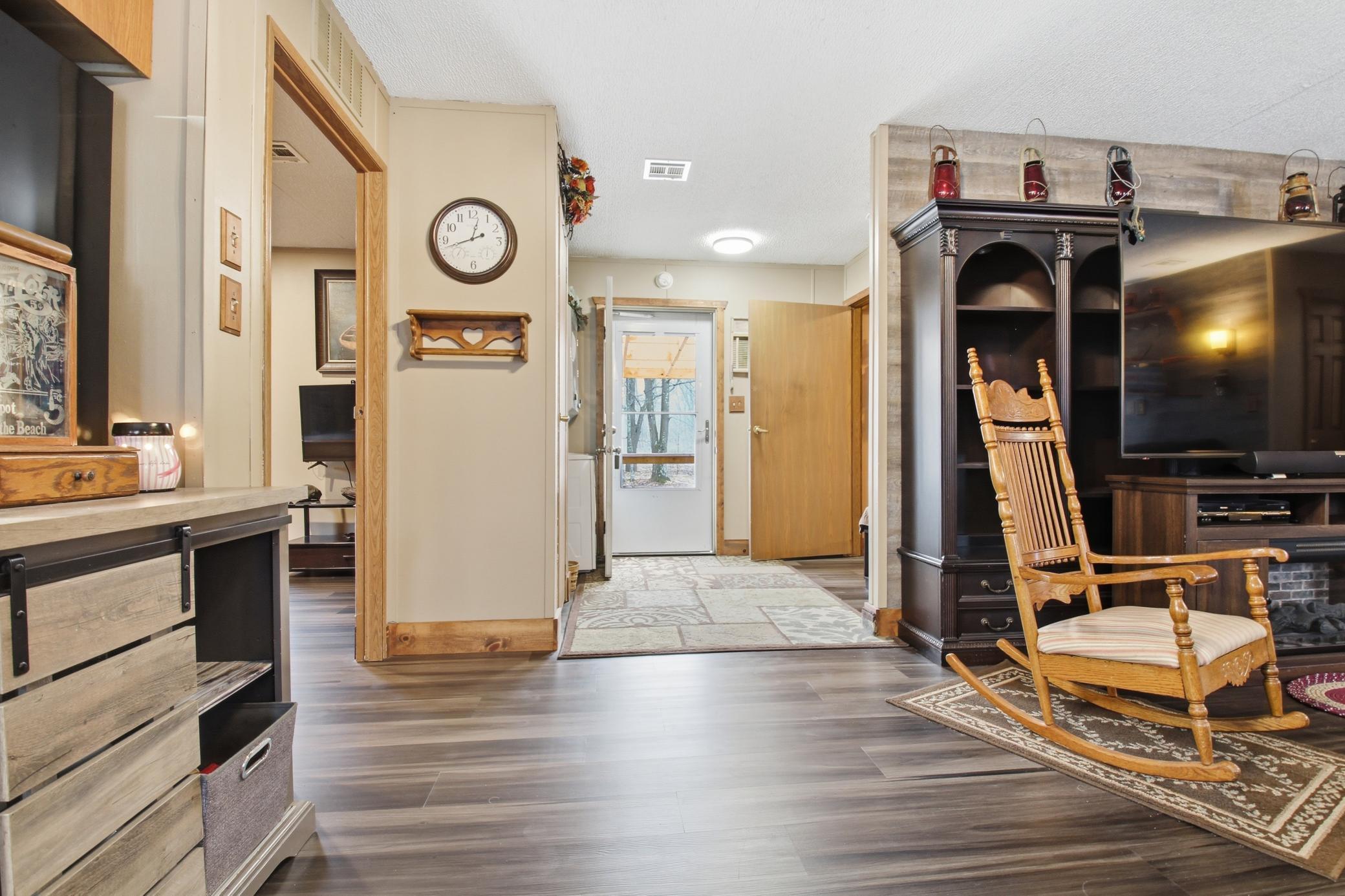 View toward the home’s main entry, conveniently located just off the living area.