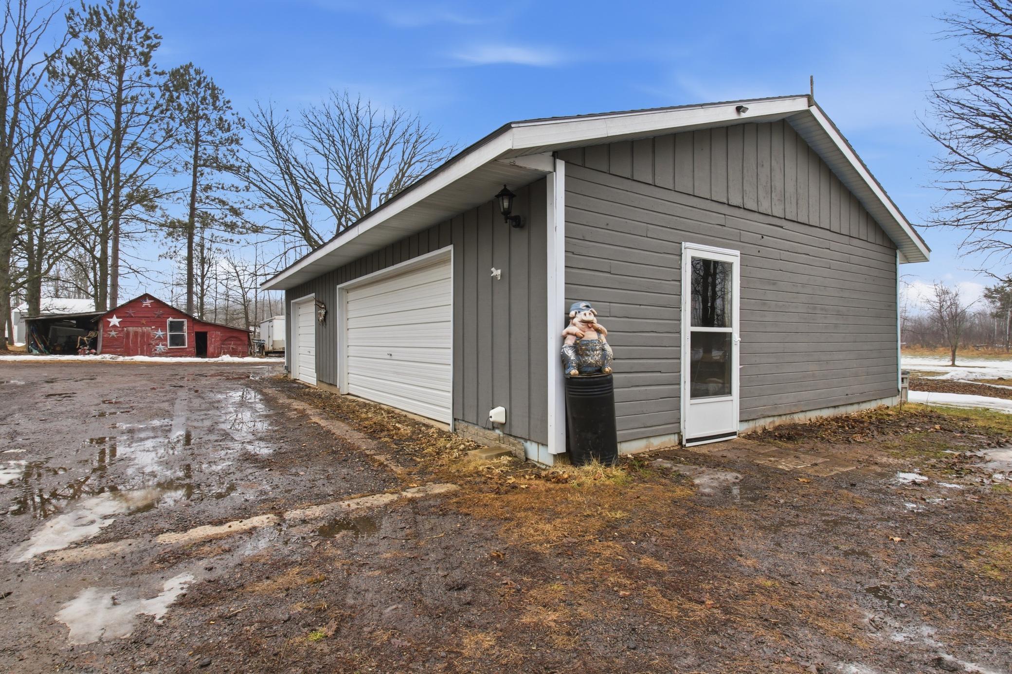 Another view of the detached garage showing convenient access and generous workspace