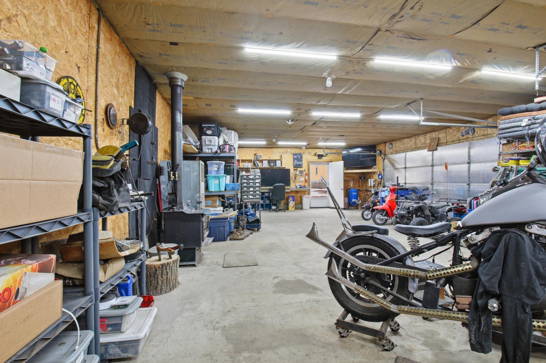 Versatile garage space ready for hobbies, tools, or recreational gear.