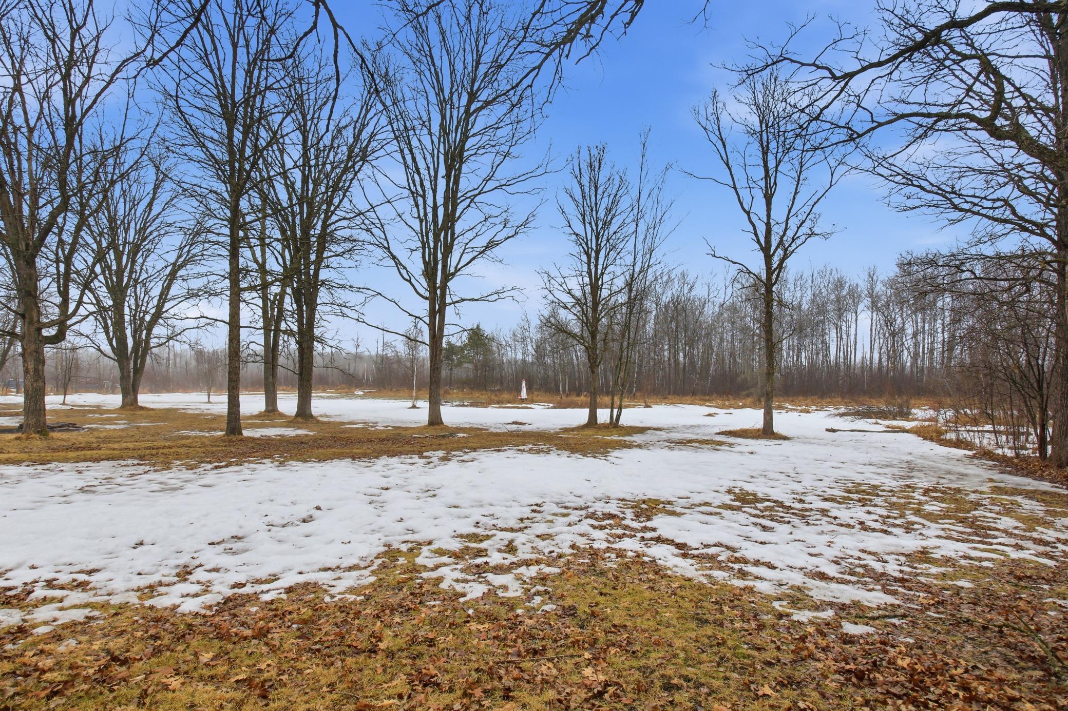Scenic pond on the property creating a peaceful outdoor setting to enjoy year-round.