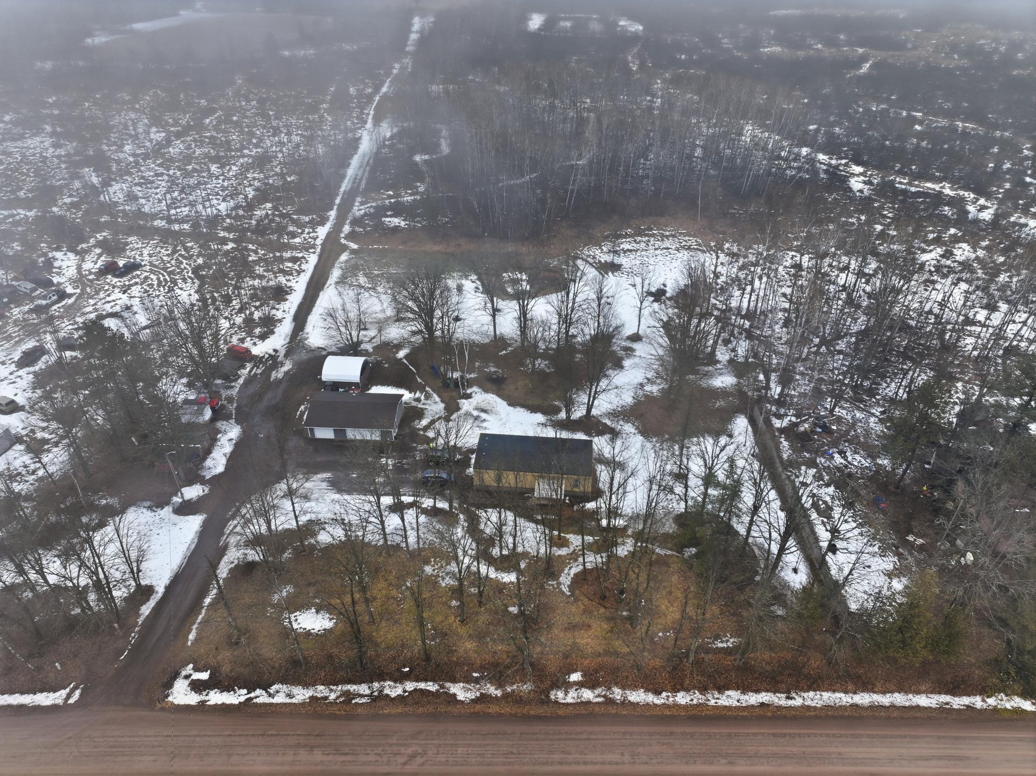 “Aerial view showing the generous yard space and natural surroundings.”.jpg