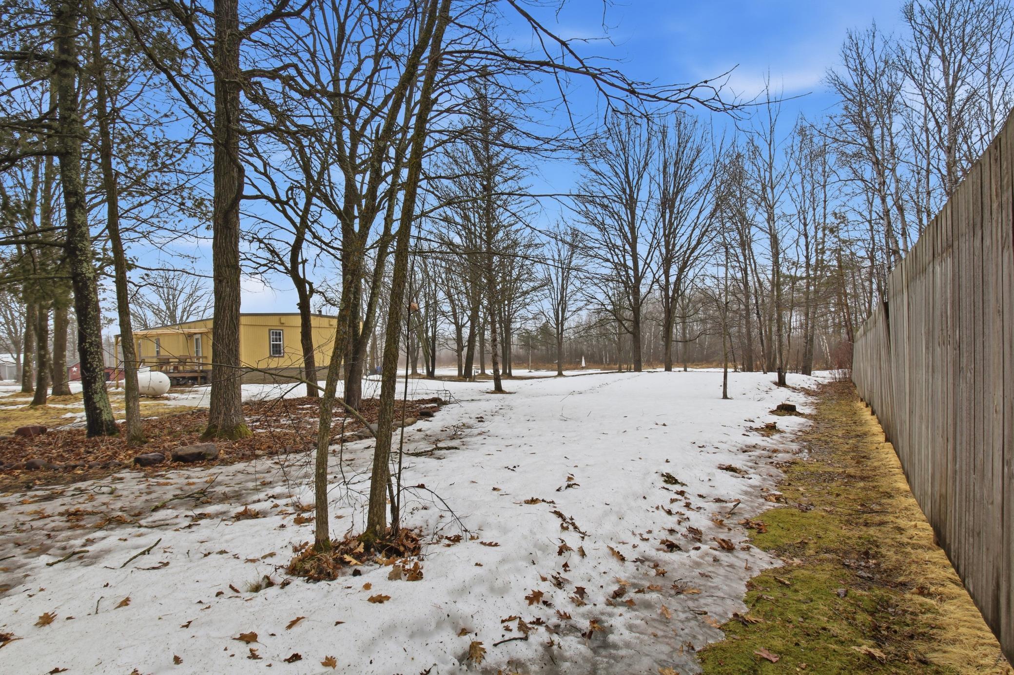 Set among mature trees, the property offers a sense of privacy while still providing open yard space to enjoy