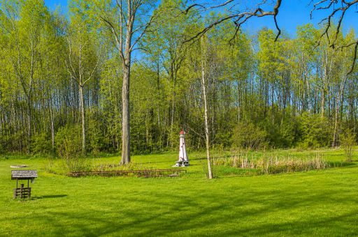 Expansive outdoor space with mature trees and peaceful countryside views.
