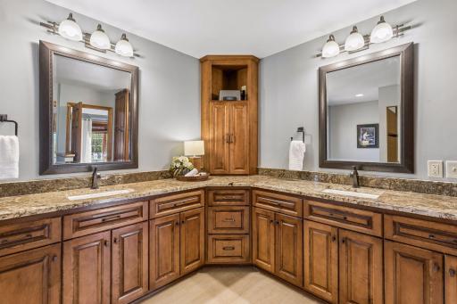 Separate vanities in the primary bathroom.
