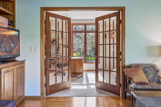 French doors open from the office to the living area.