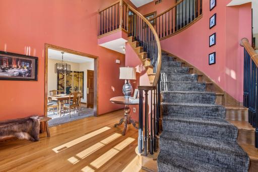 Beautiful two-story entrance with a winding staircase.
