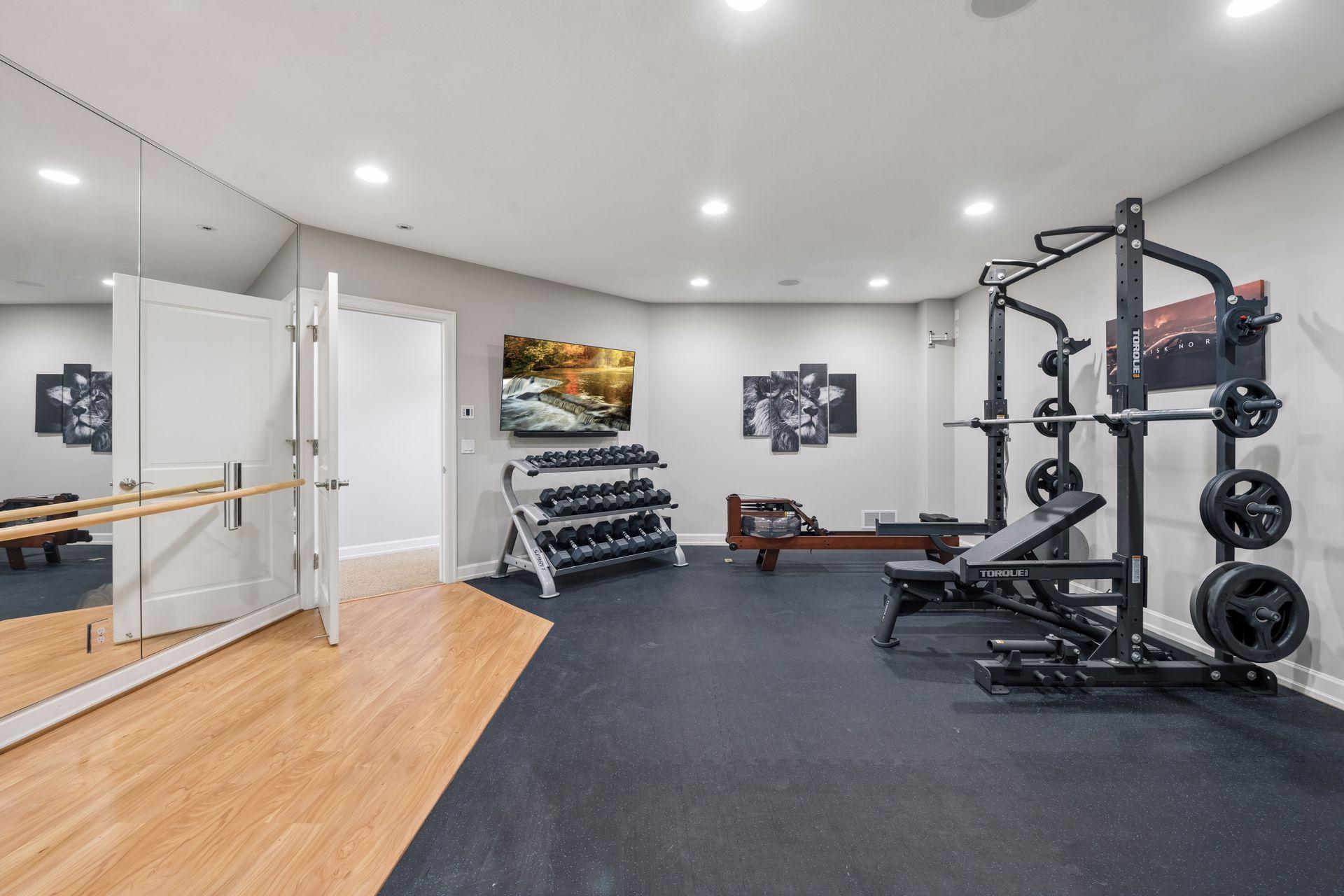 The home gym was completed in 2021 and has cardio space, a barre wall, and plenty of space for machines and free weights.