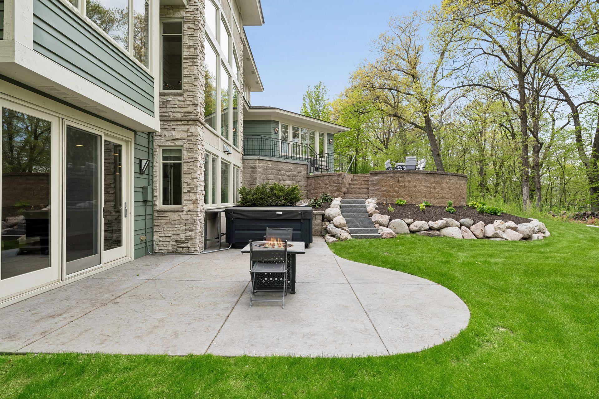 Over $200k in outdoor improvements in the last 5 years, including all new stamped concrete patios, hot tub wiring, boulder walls and stairs, full lawn regrading (with smart irrigation system), and more.
