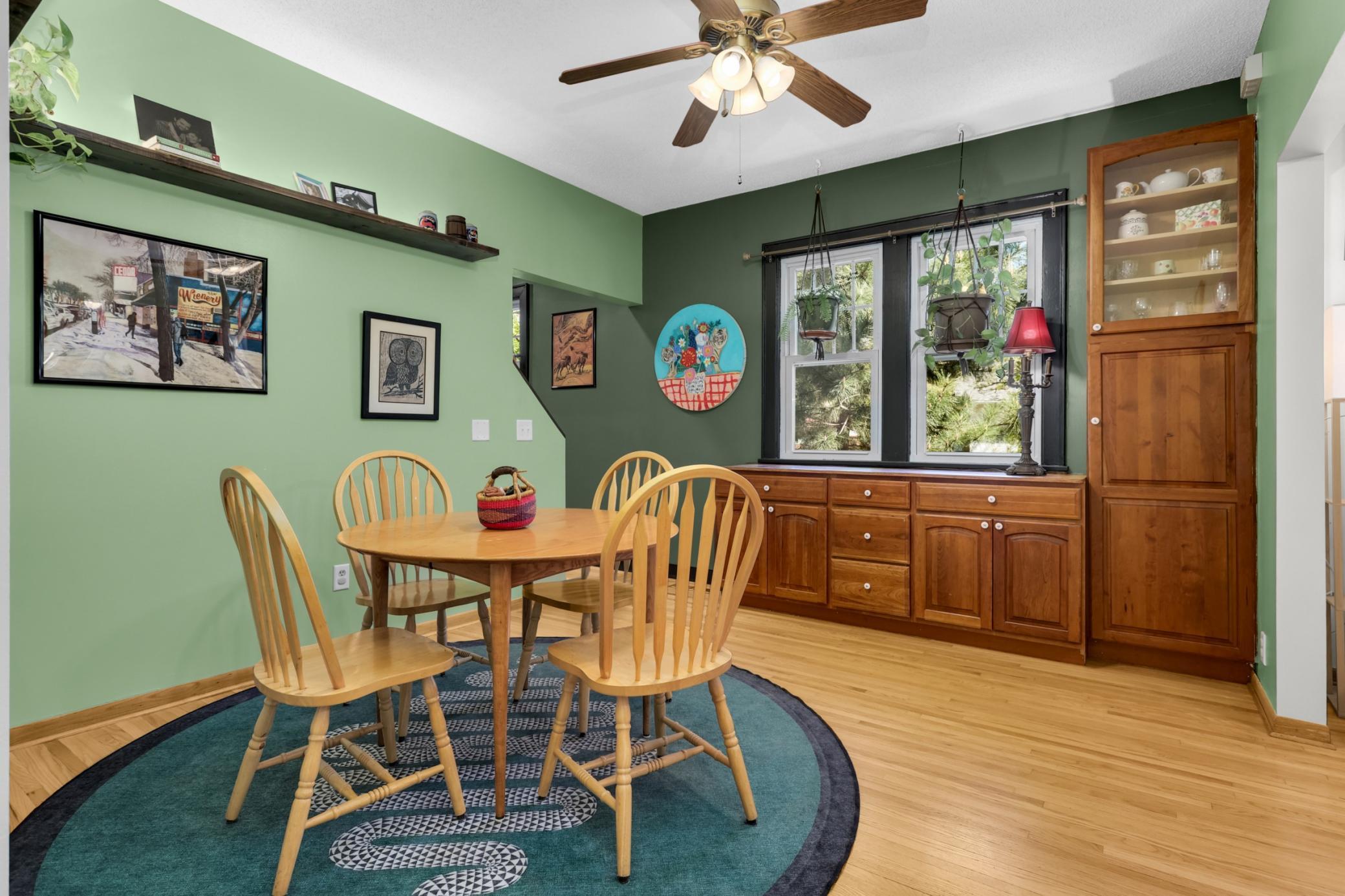 Dining room featuring custom cherry built-in cabinetry, offering rich wood tones, elegant craftsmanship, and valuable additional storage with a refined, classic finish.
