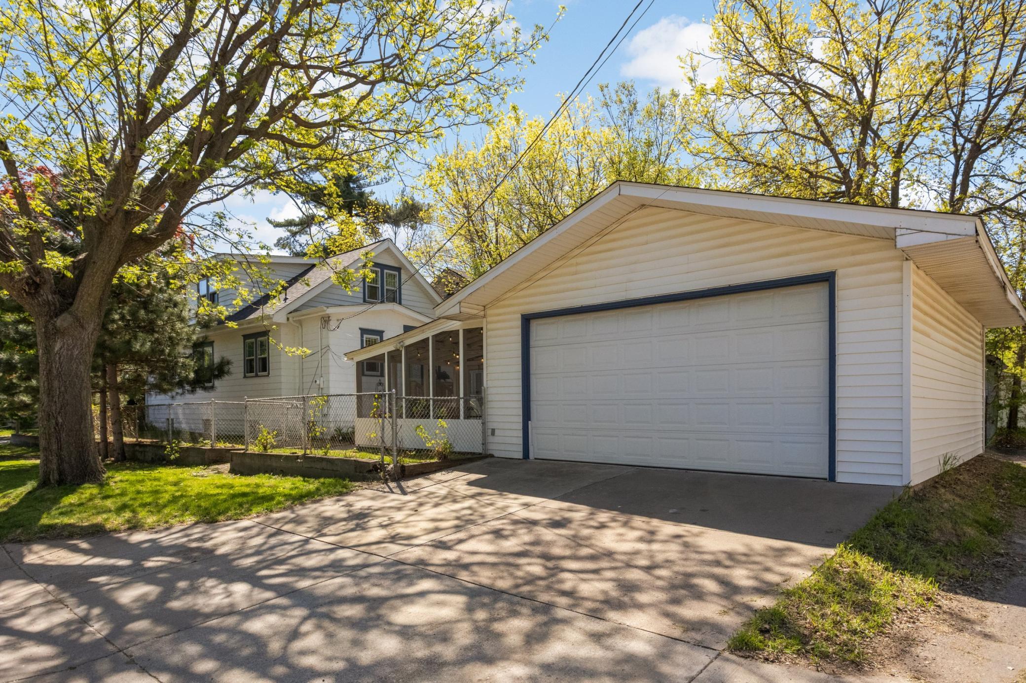 Large 24x22 garage with an attached screened porch ideal for summer evenings.