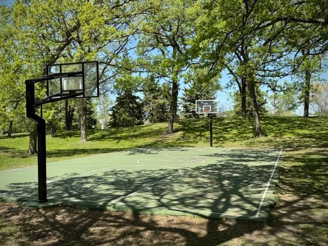 Stay active and cool with this shaded outdoor basketball court nearby.