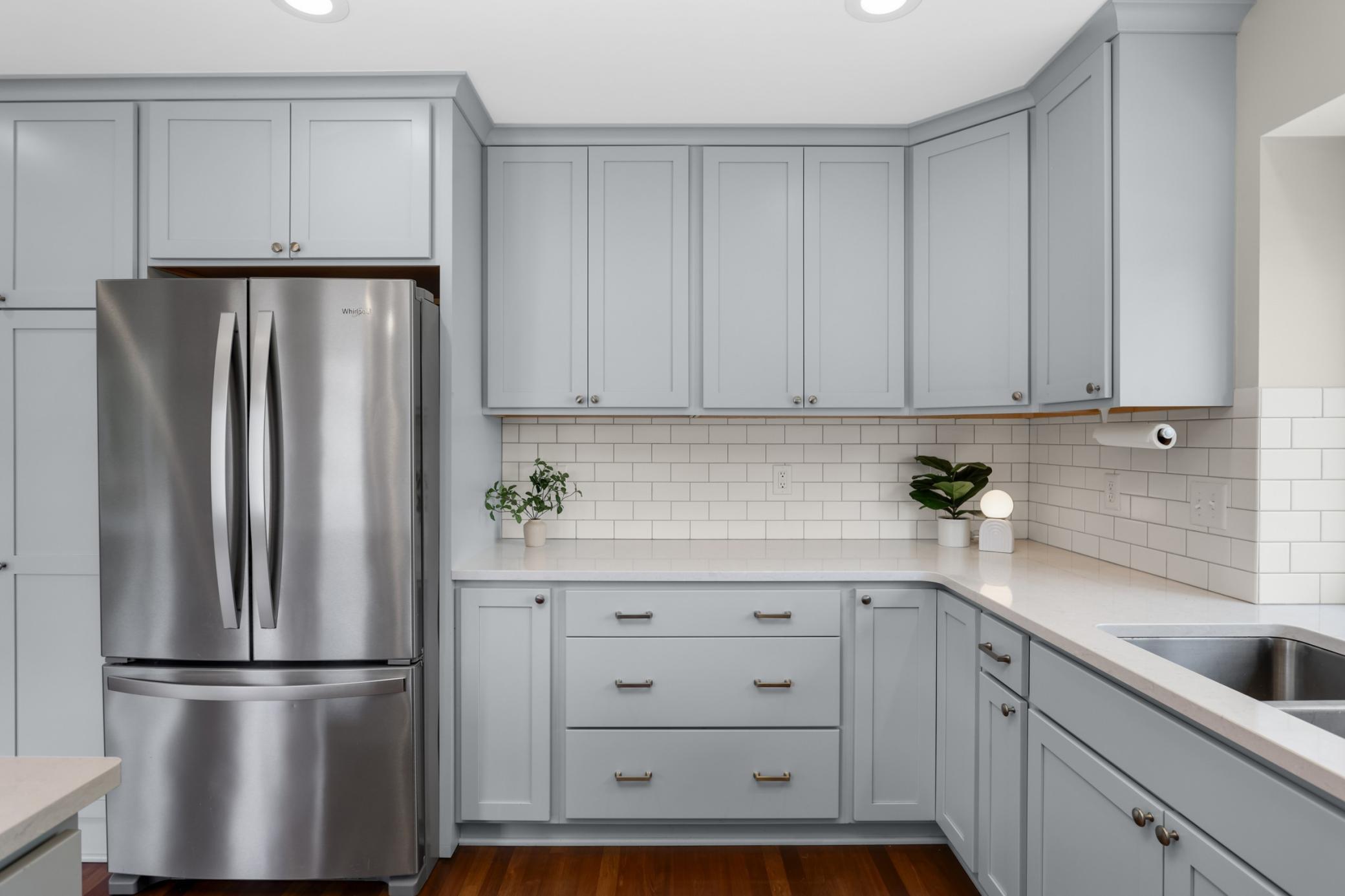 Updated kitchen featuring modern finishes, excellent workspace.