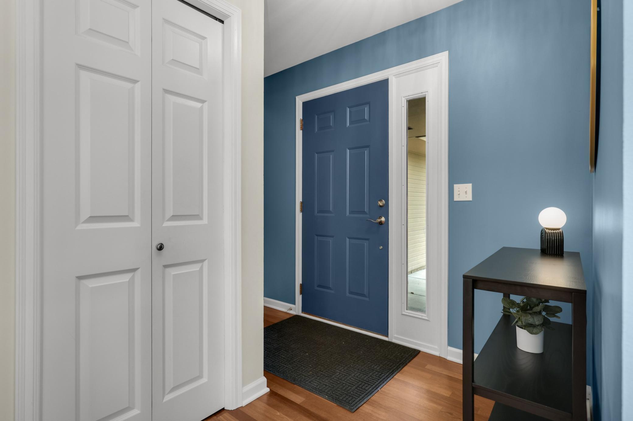 Welcoming front foyer with a convenient coat closet, creating a functional and inviting entryway for guests and everyday living.