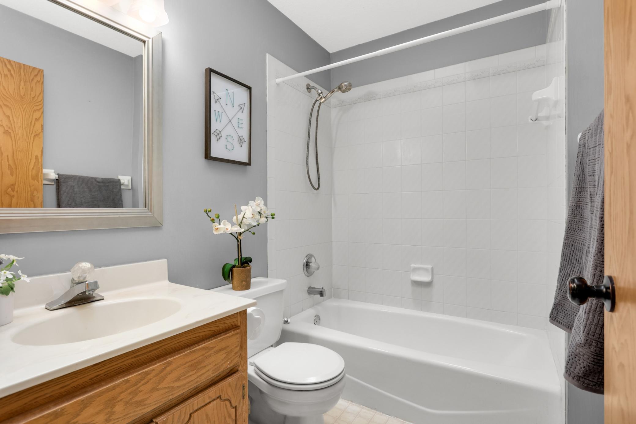 Upper-level full bathroom providing practical convenience and serving the bedroom level with an efficient, well-maintained design.