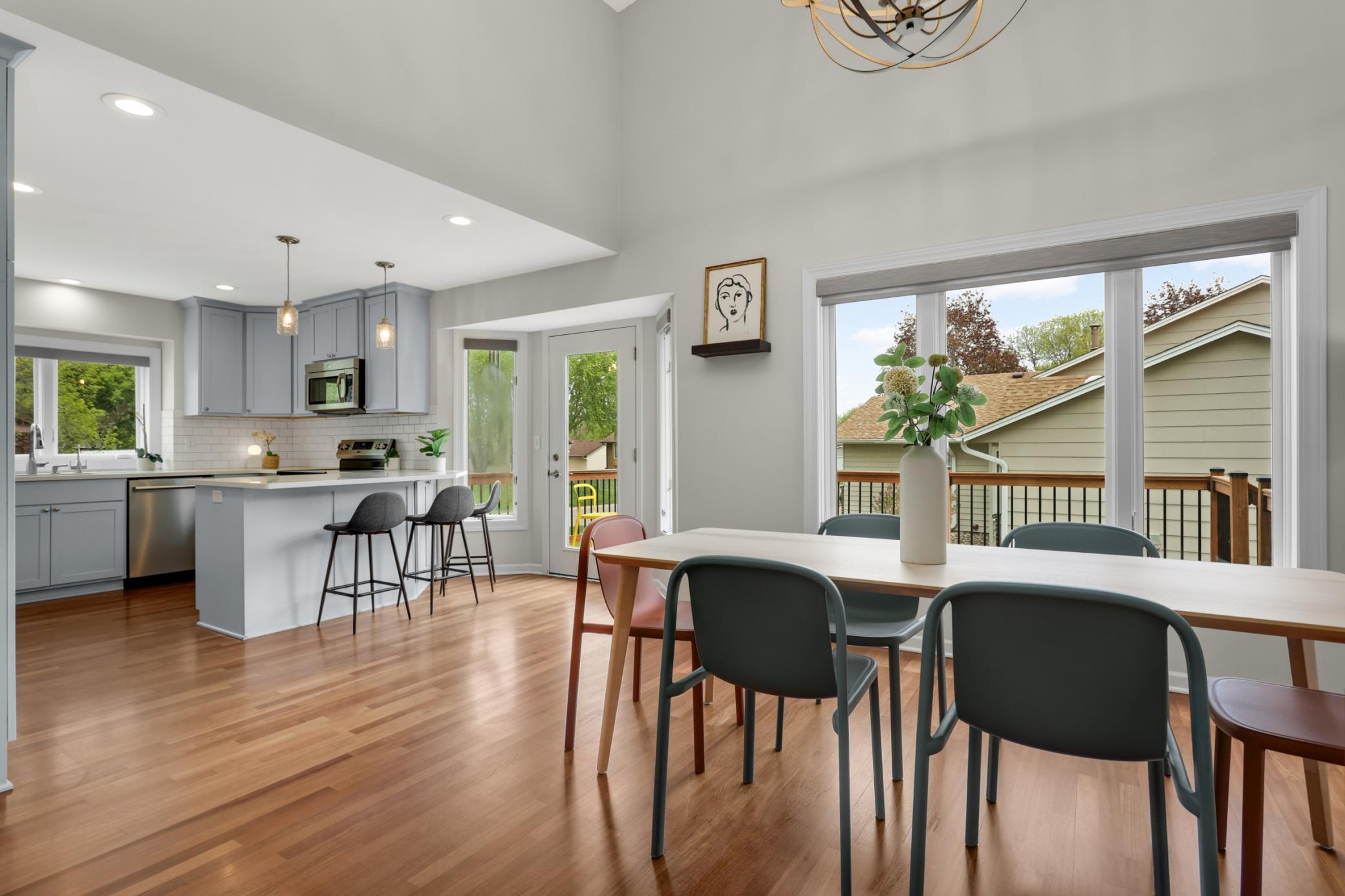 The redesigned kitchen serves as the heart of the home with updated finishes, excellent workspace, and seamless flow into the main living areas.