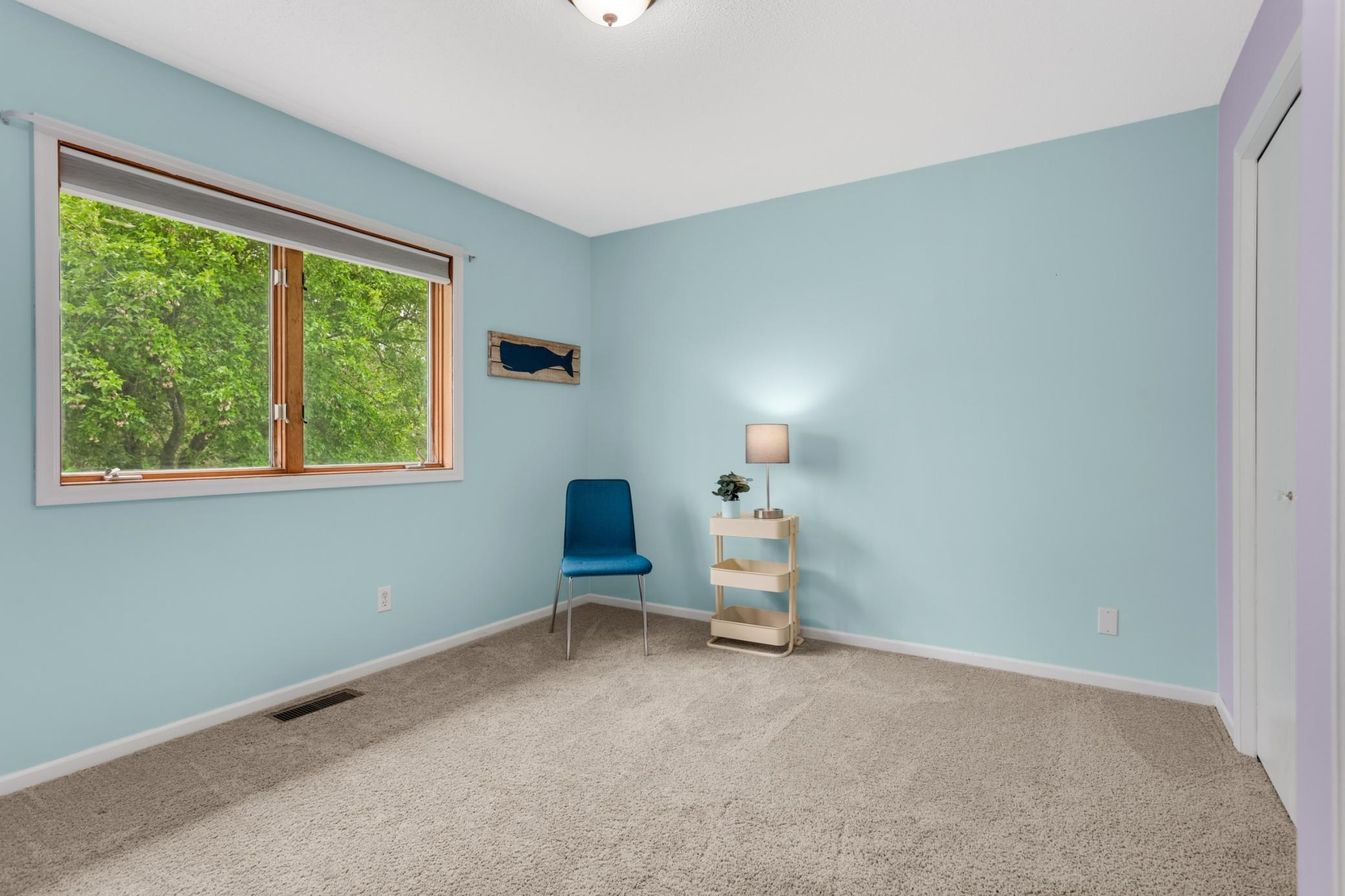 pacious second bedroom with an inviting layout and ample closet space for everyday functionality.