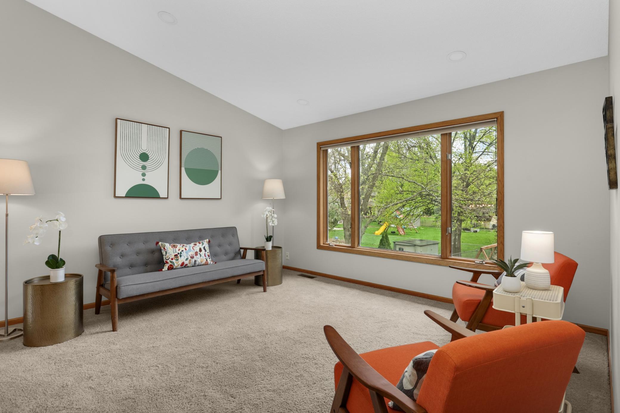 Bright and inviting living room filled with natural light and designed for comfortable gatherings with family and friends.