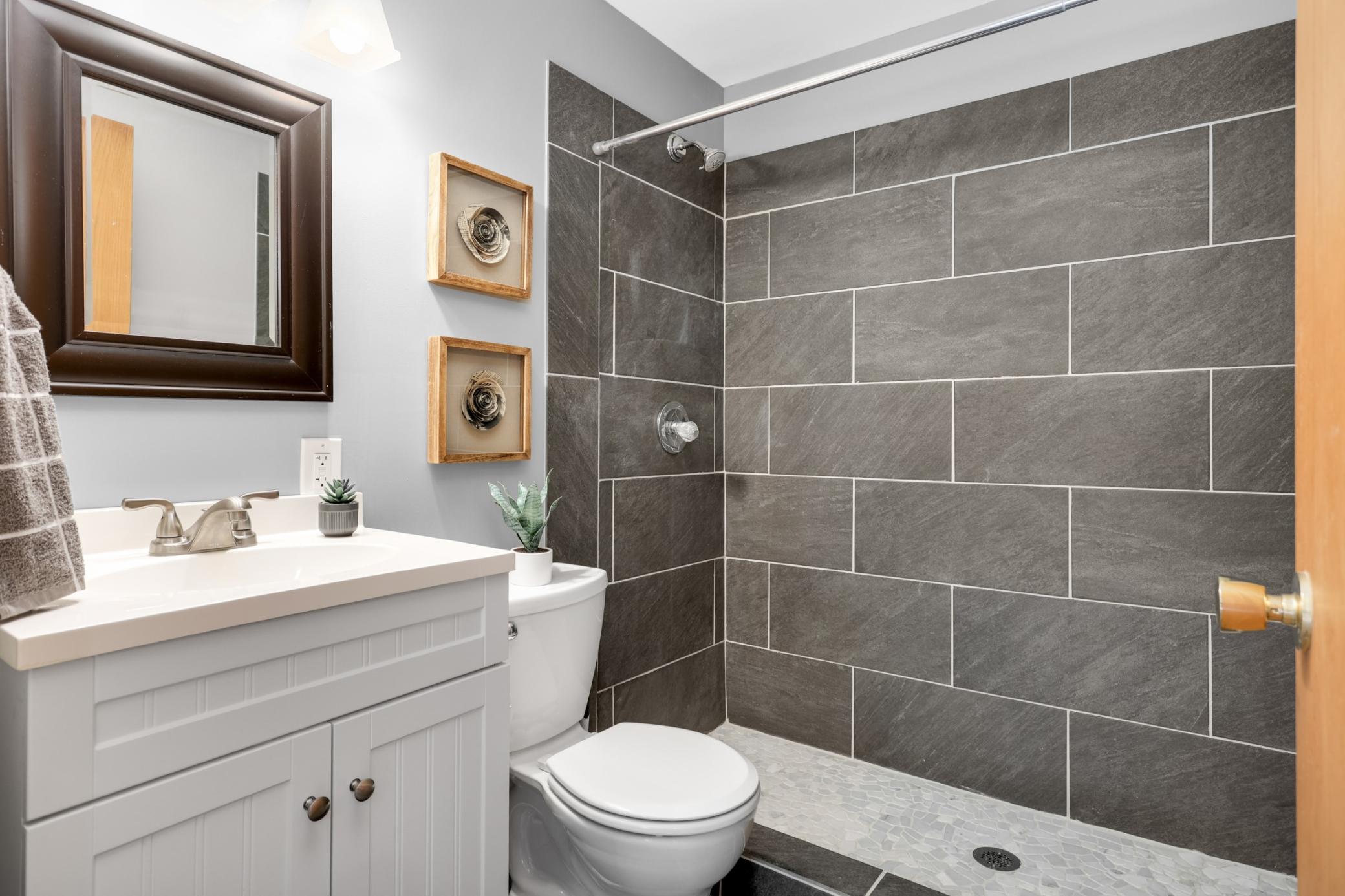 Updated bathroom with clean finishes and functional design.