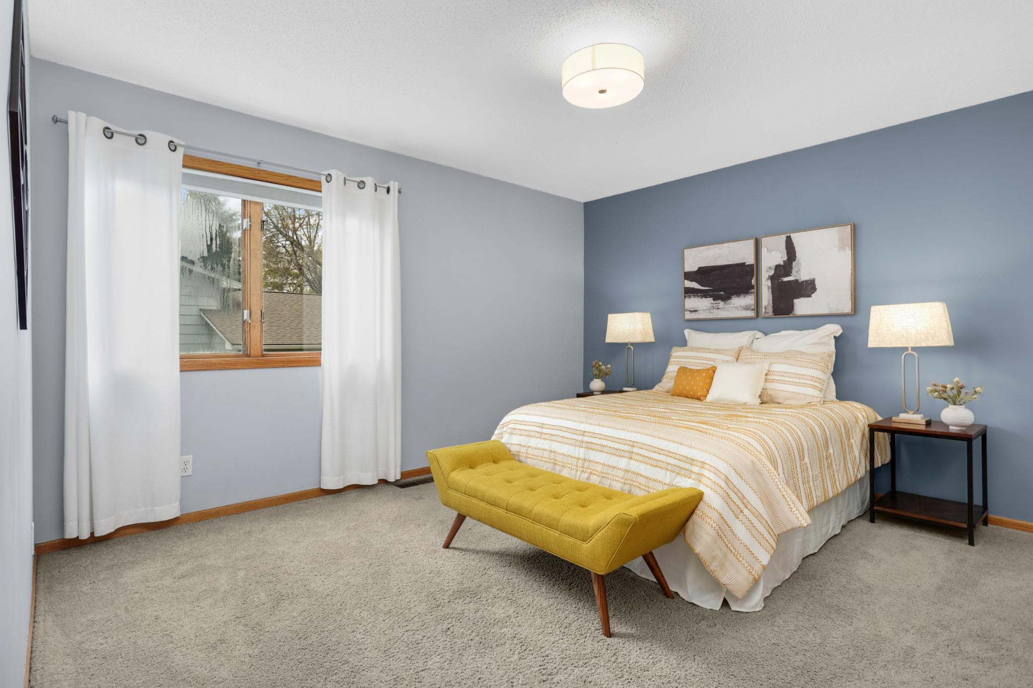 Generously sized bedrooms and updated bathrooms add to the home’s functionality and comfort.