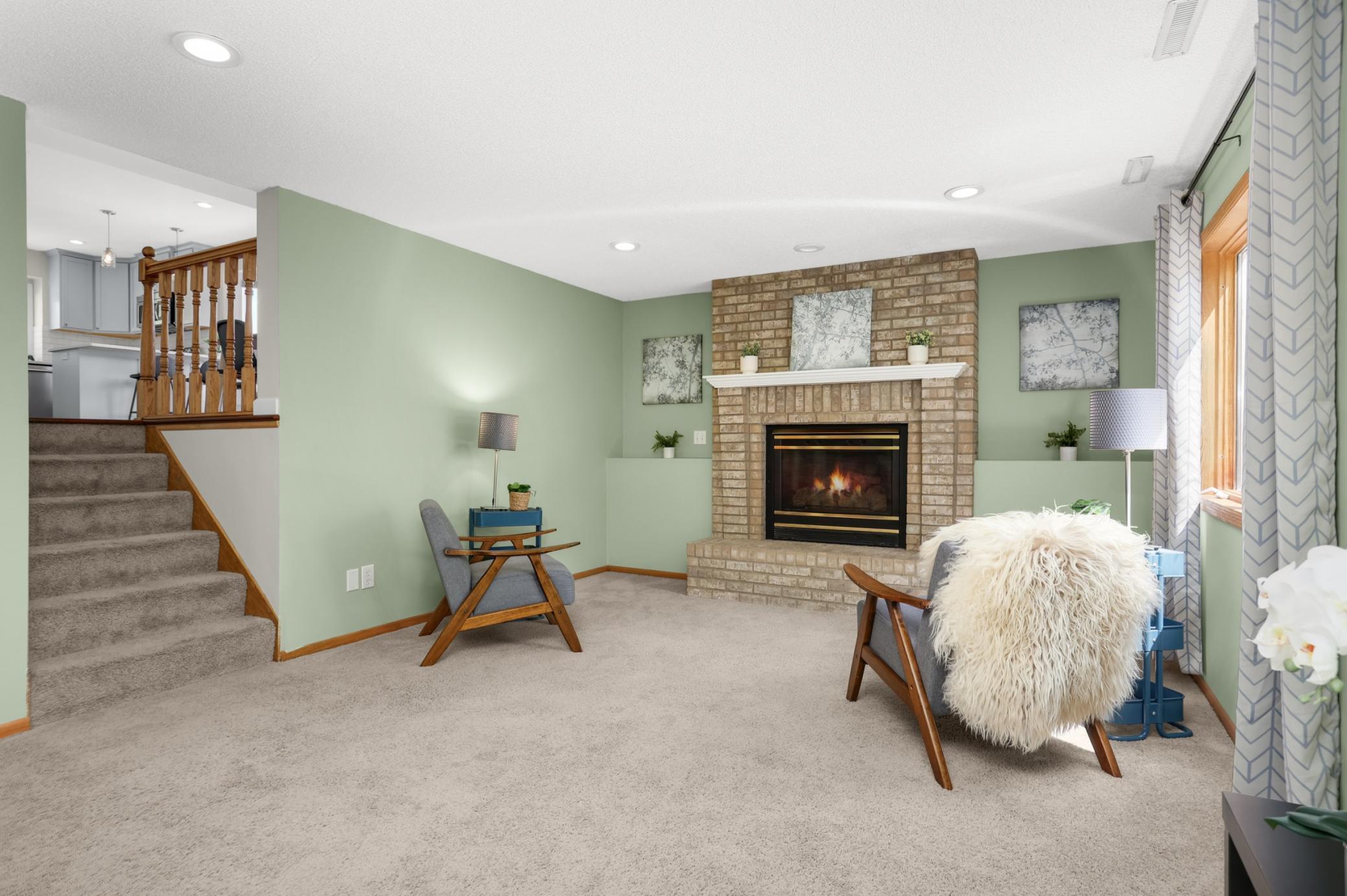 Inviting family room highlighted by a gas fireplace, perfect for cozy nights in and entertaining guests.