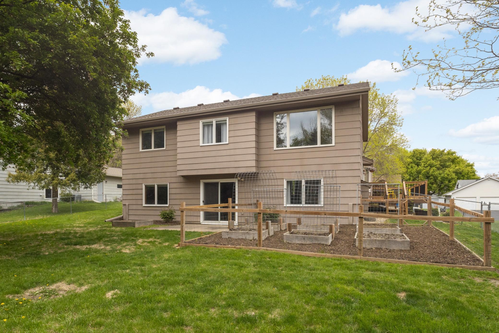 Outside, enjoy the private backyard with plenty of space for relaxing, grilling, or spending time outdoors during Minnesota summers.
