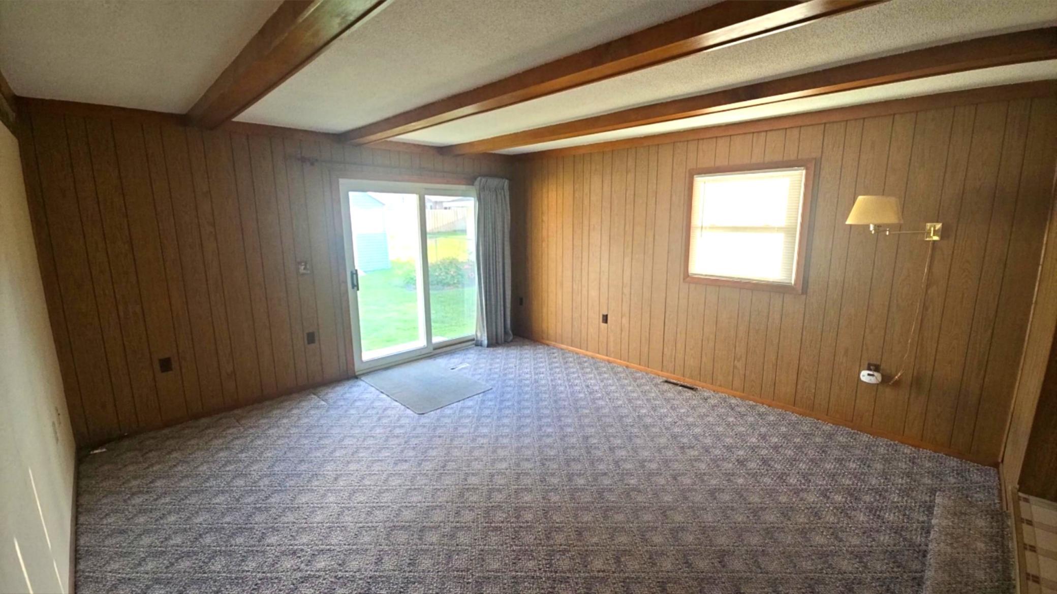 Spacious family room that leads to the fully fenced back yard.