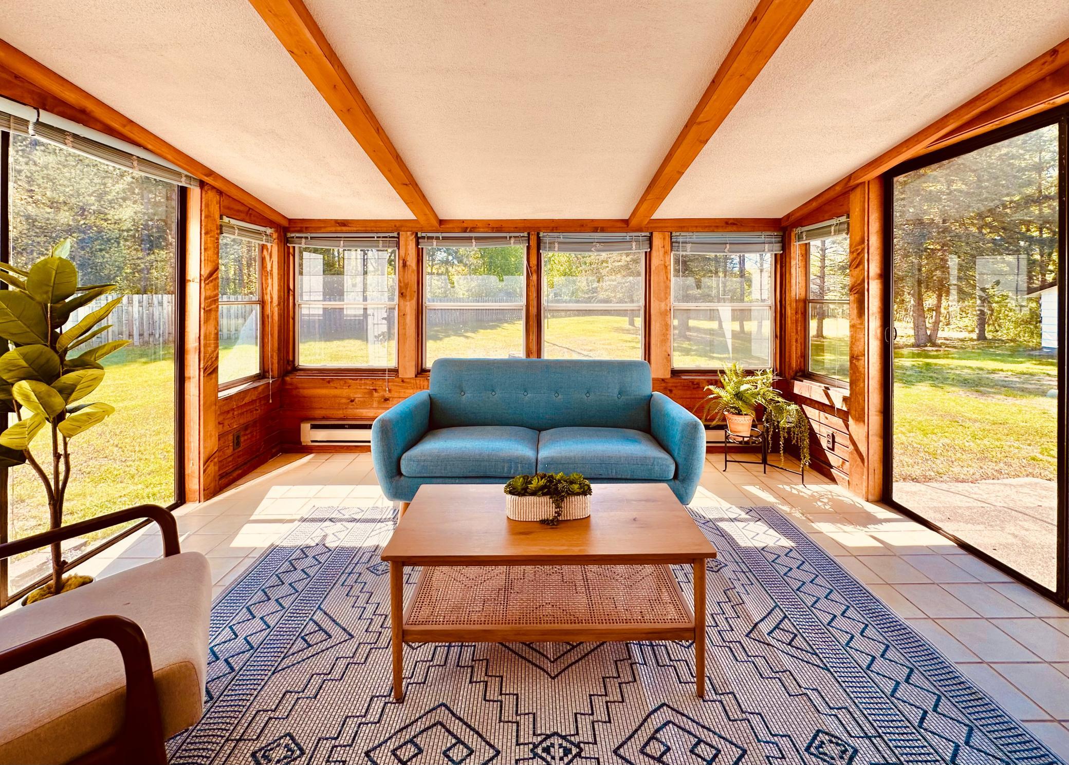 Lovely glass-enclosed porch, with sliding door to massive back yard!