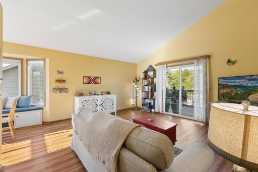 The living room offers great natural lighting through the patio door that leads out to your lovely 2-tier deck overlooking the backyard.