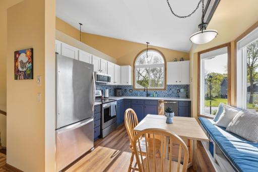 The recently updated kitchen offers updated cabinets, stainless steel appliances, and stone countertops.