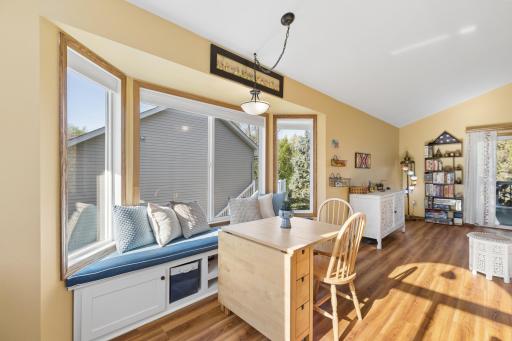 Gorgeous bay window offers additional seating and great natural light.