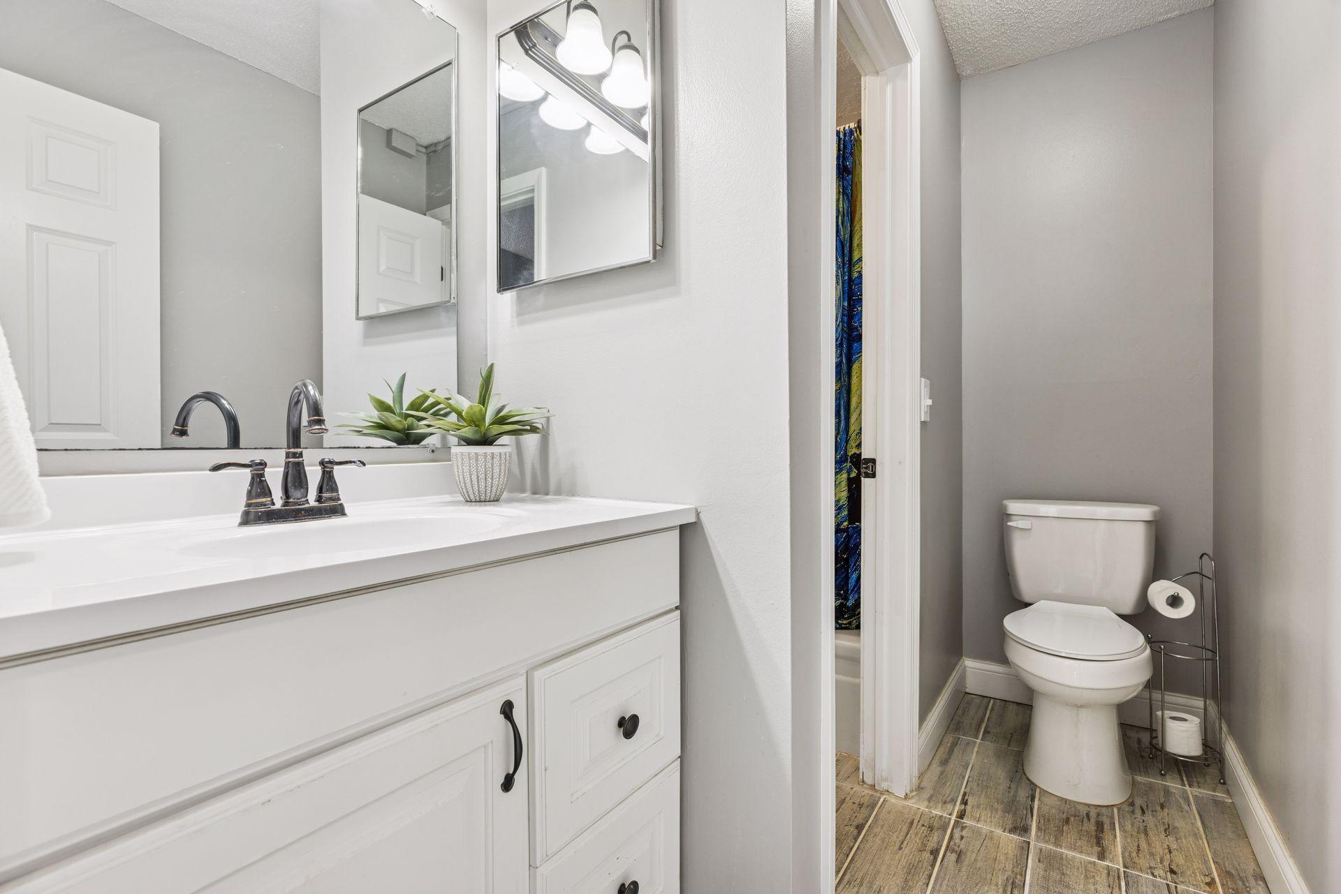 Please note that there is 1.25 baths total. A sink vanity area, with a walk-through full tub/shower area, into another area with toilet and sink (pictured here)