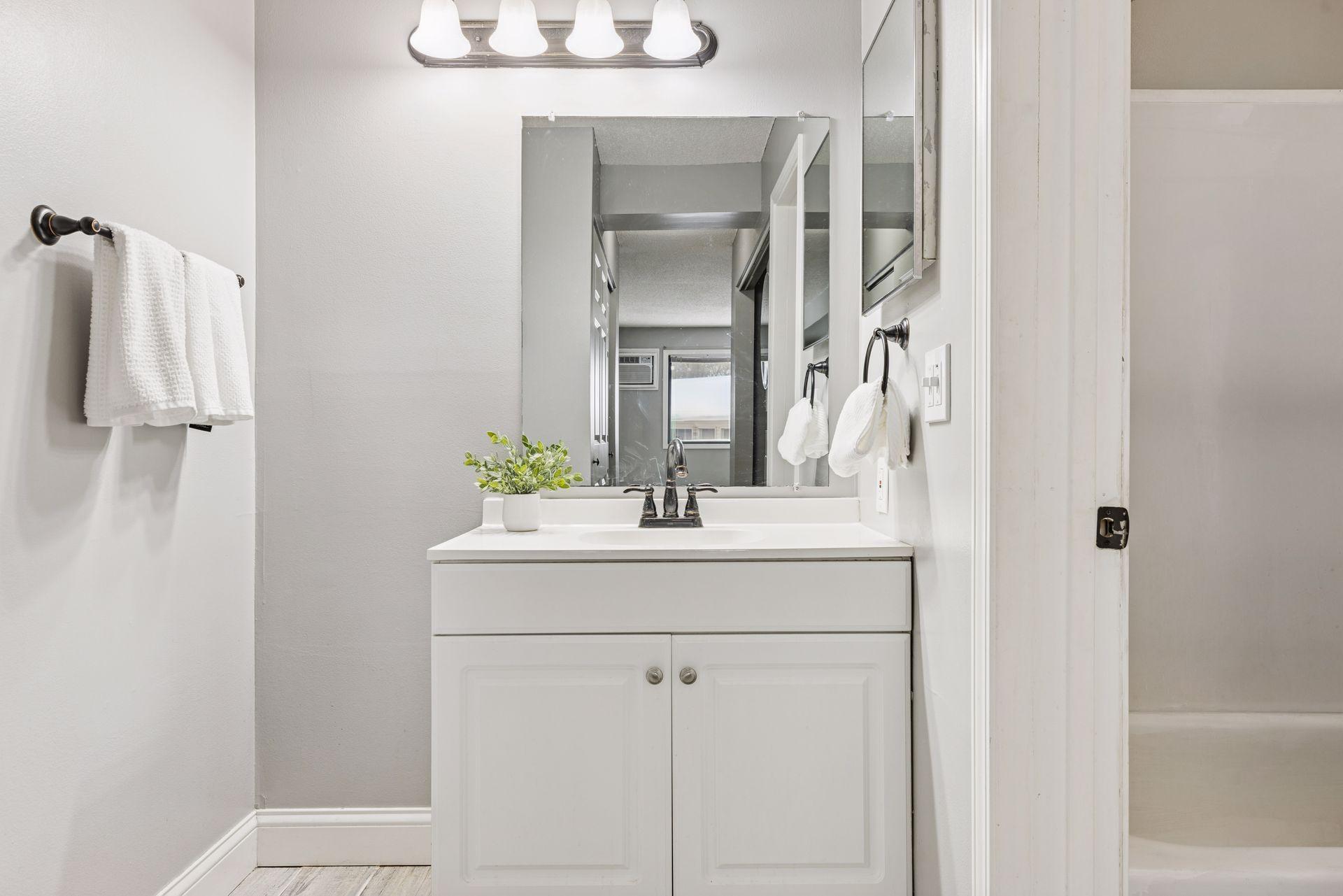 The well-designed walk-through bathroom provides exceptional functionality with two separate vanity areas,