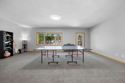 The finished walkout lower level expands your living and entertaining options with a spacious recreation area and wet bar.