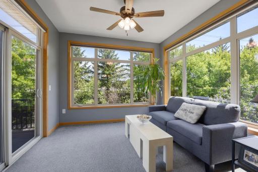 Surrounded by natural light, the sunroom offers the perfect space to relax year-round and provides direct access to the maintenance-free deck.