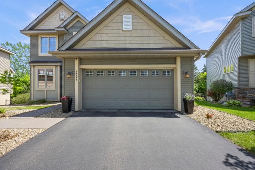 A tandem garage provides extended depth for front-to-back parking and additional storage space. Recent updates include an EV charger and a newly installed water softener for added modern convenience.