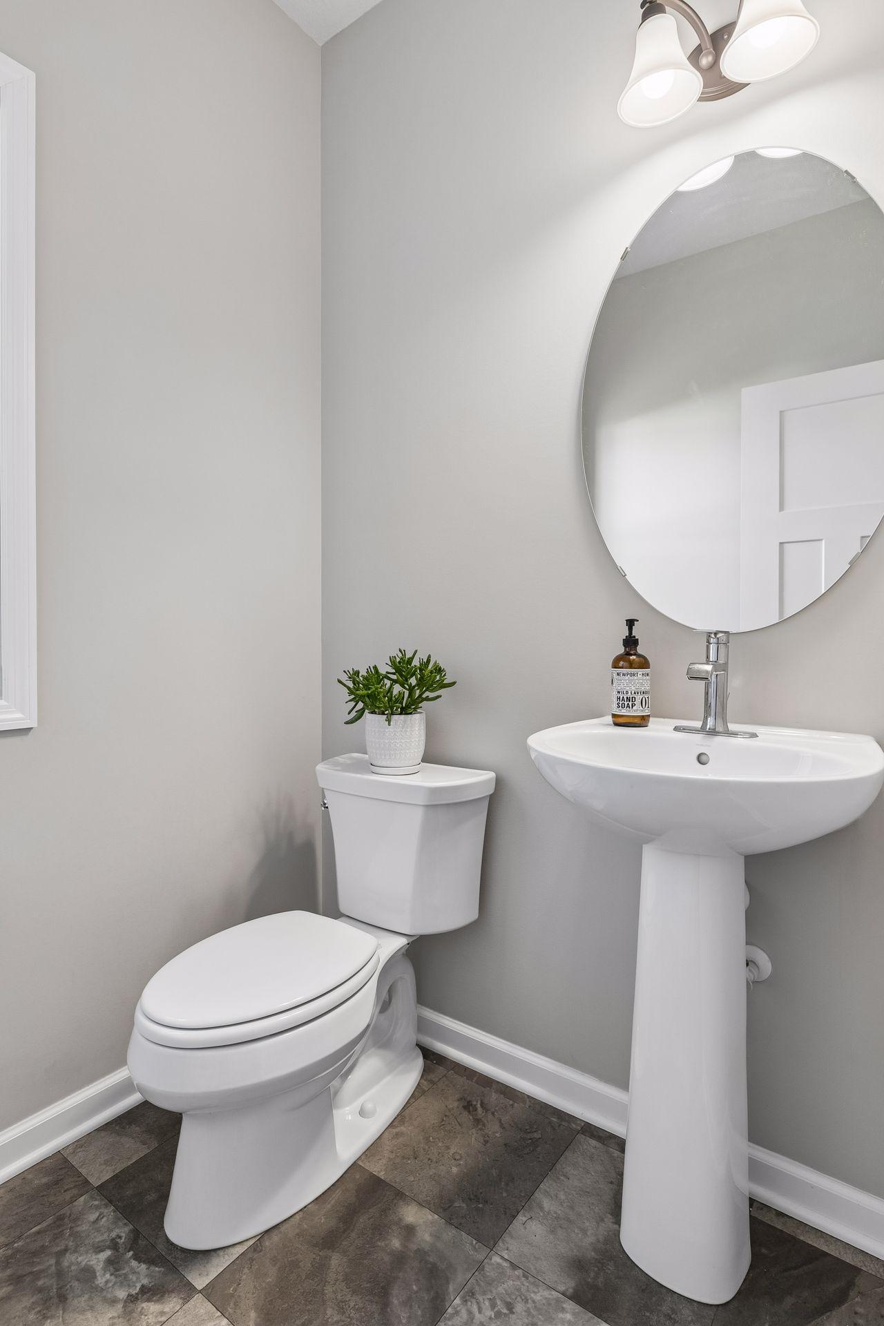 Main level 1/2 bath off LARGE mud room.