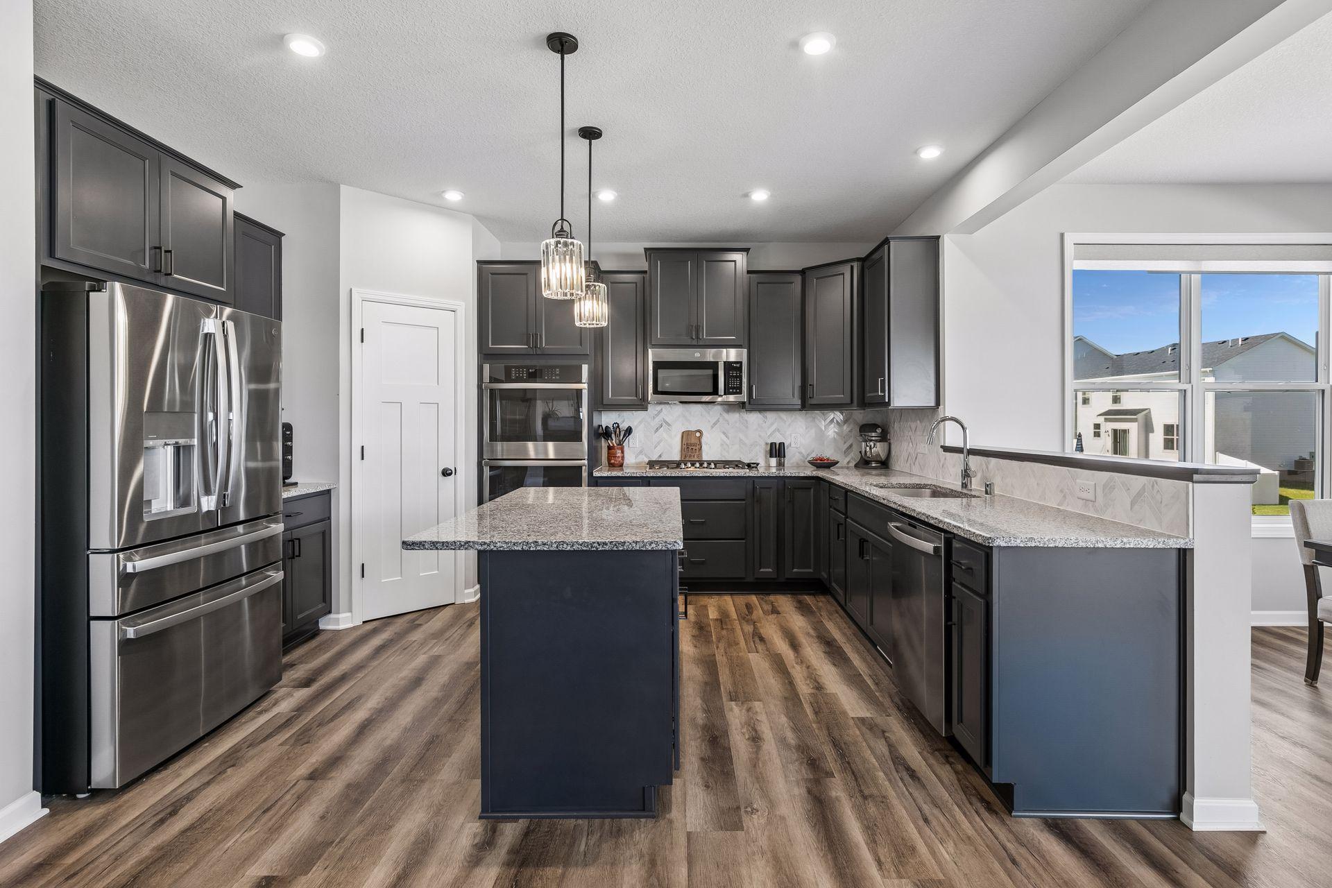 Kitchen features upgraded appliances, double wall oven