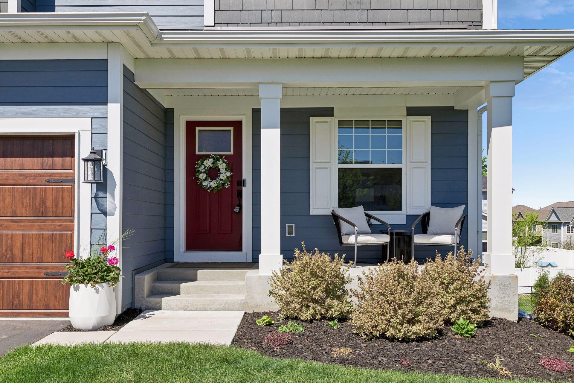 Welcoming front porch with gorgeous landscaping
