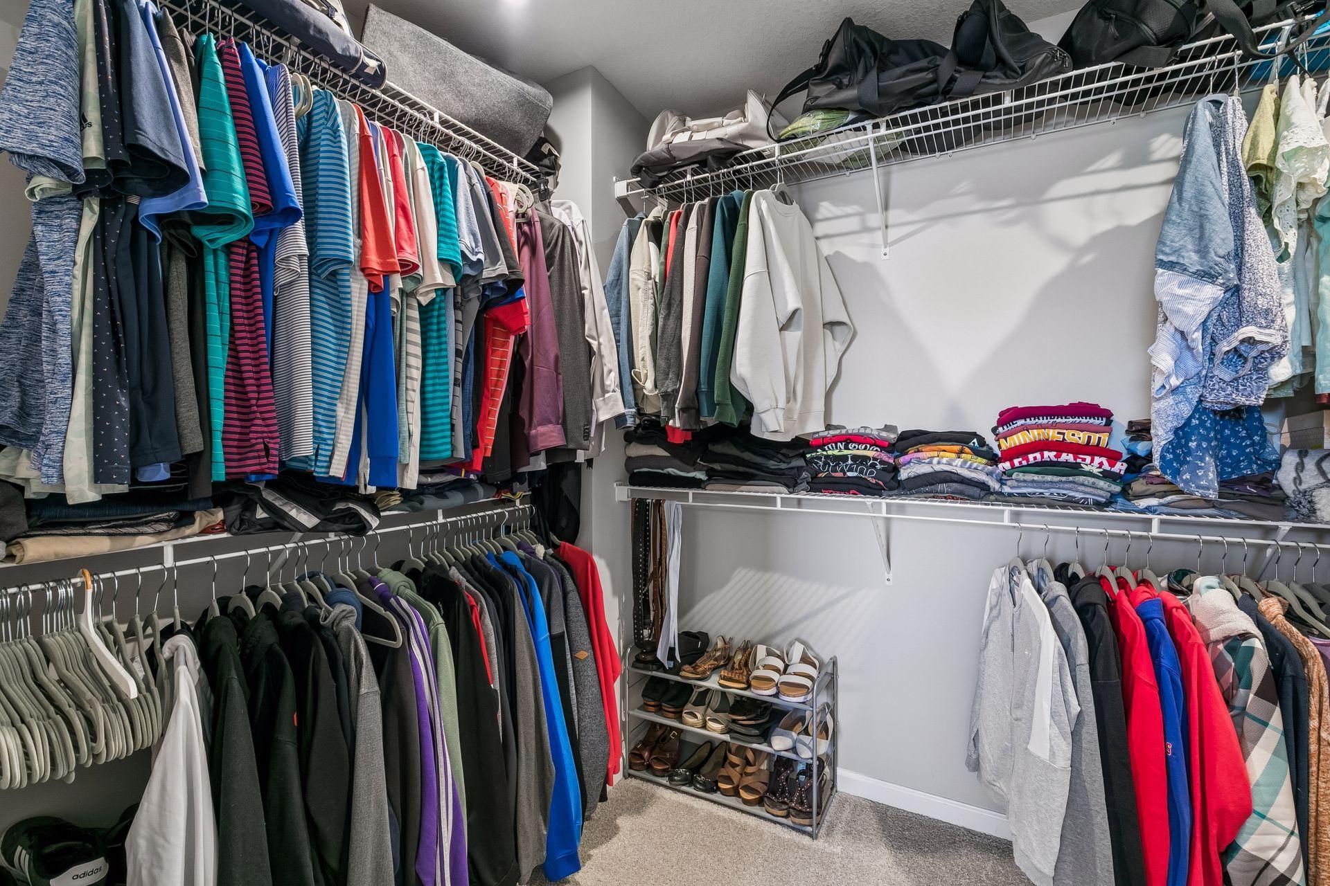 Primary bedroom walk-in closet