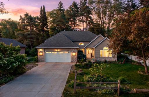 Welcome to 1320 Griffin Ave in Mahtomedi set on a private wooded lot overlooking a pond.