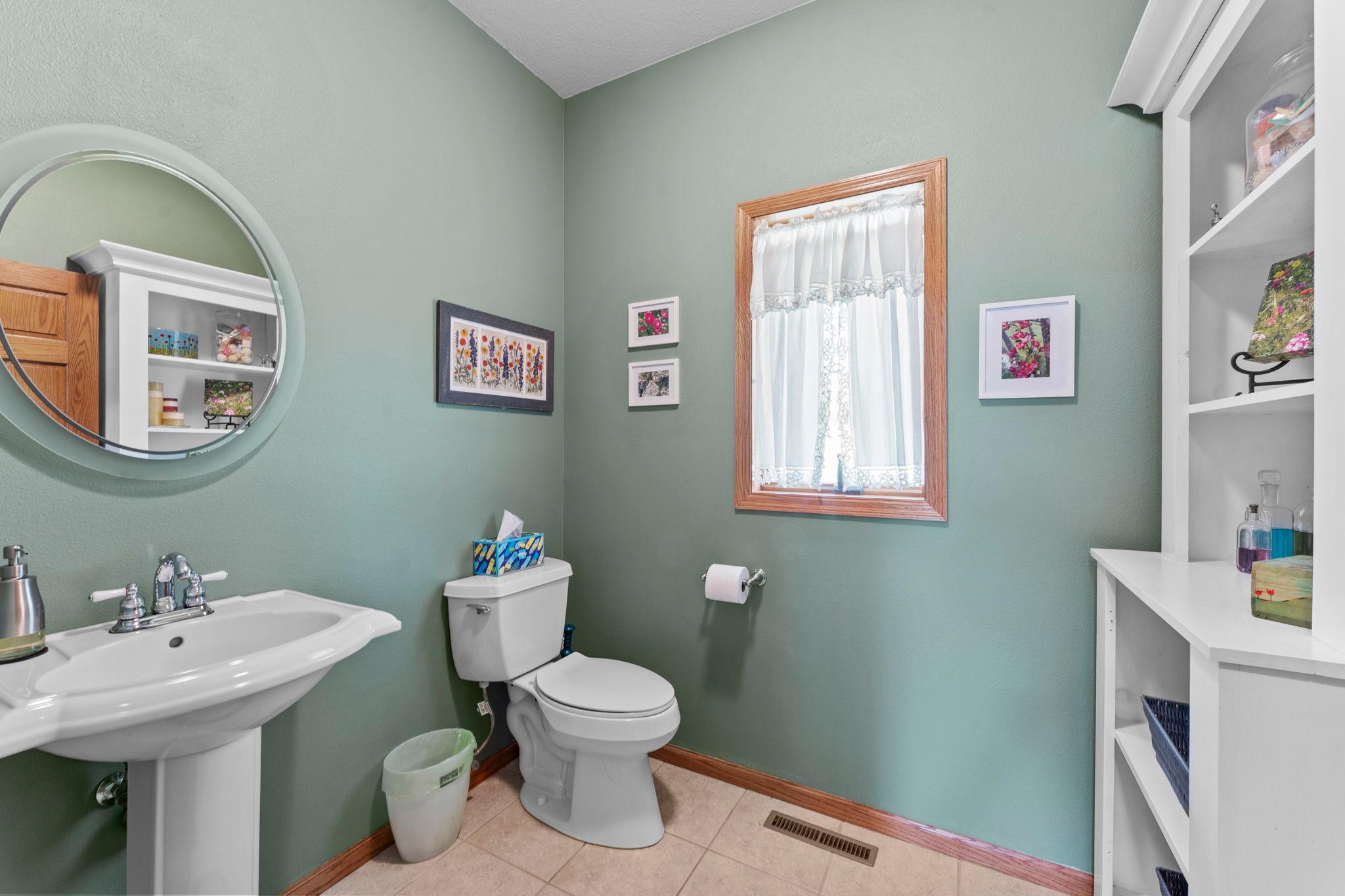 A conveniently located powder bath serves the main living areas with ease.