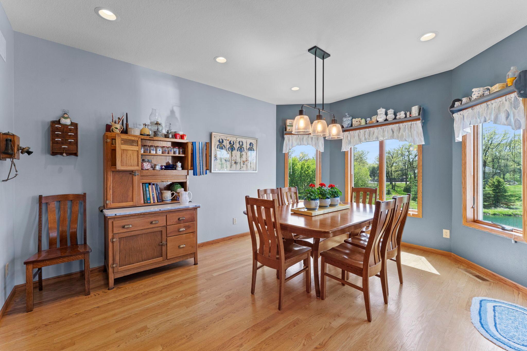 Open to the kitchen, the dining room flows seamlessly for everyday living and entertaining, anchored by a charming bay alcove.