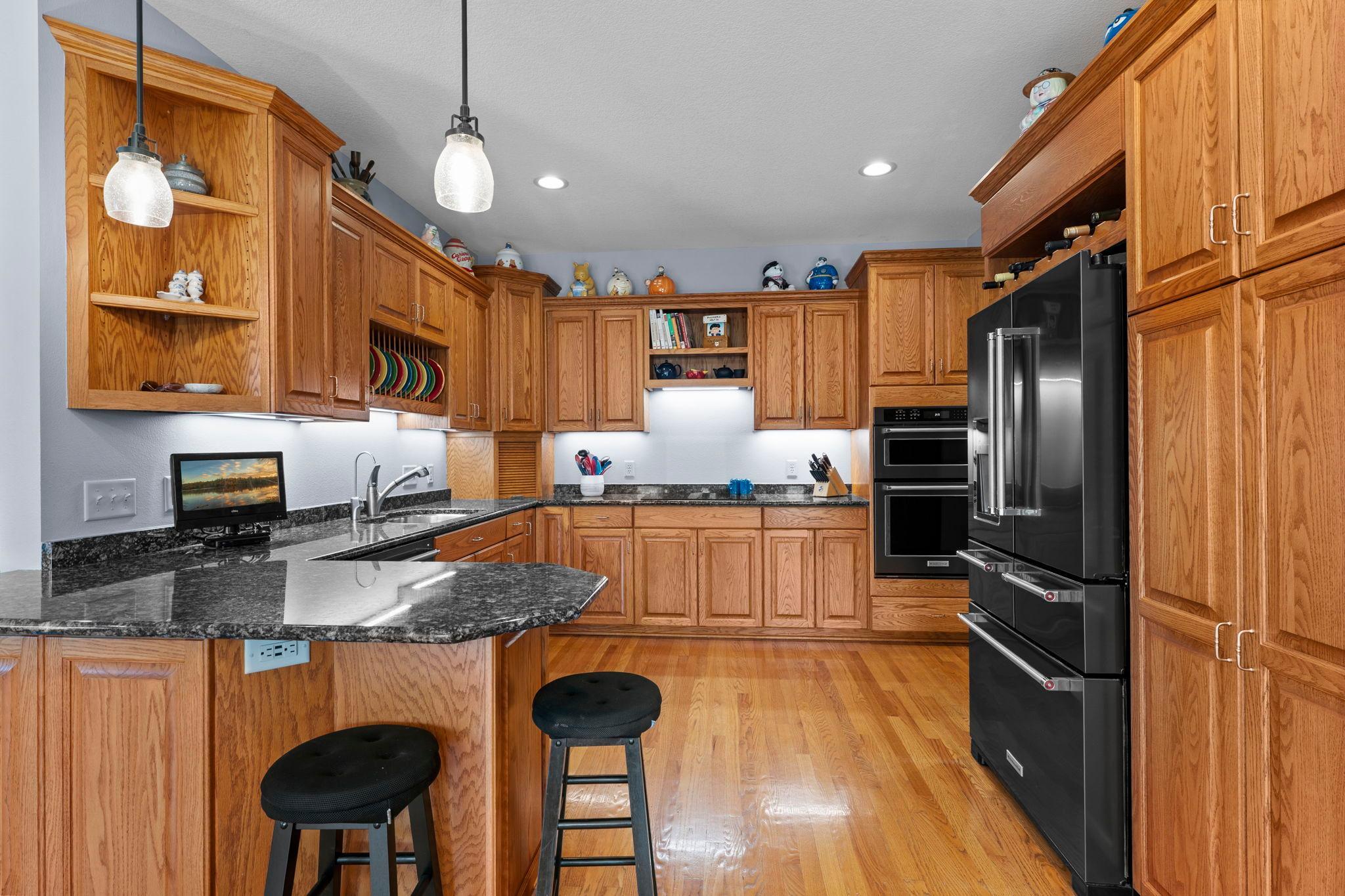 A large peninsula offers ample space for casual breakfast seating or effortless entertaining.