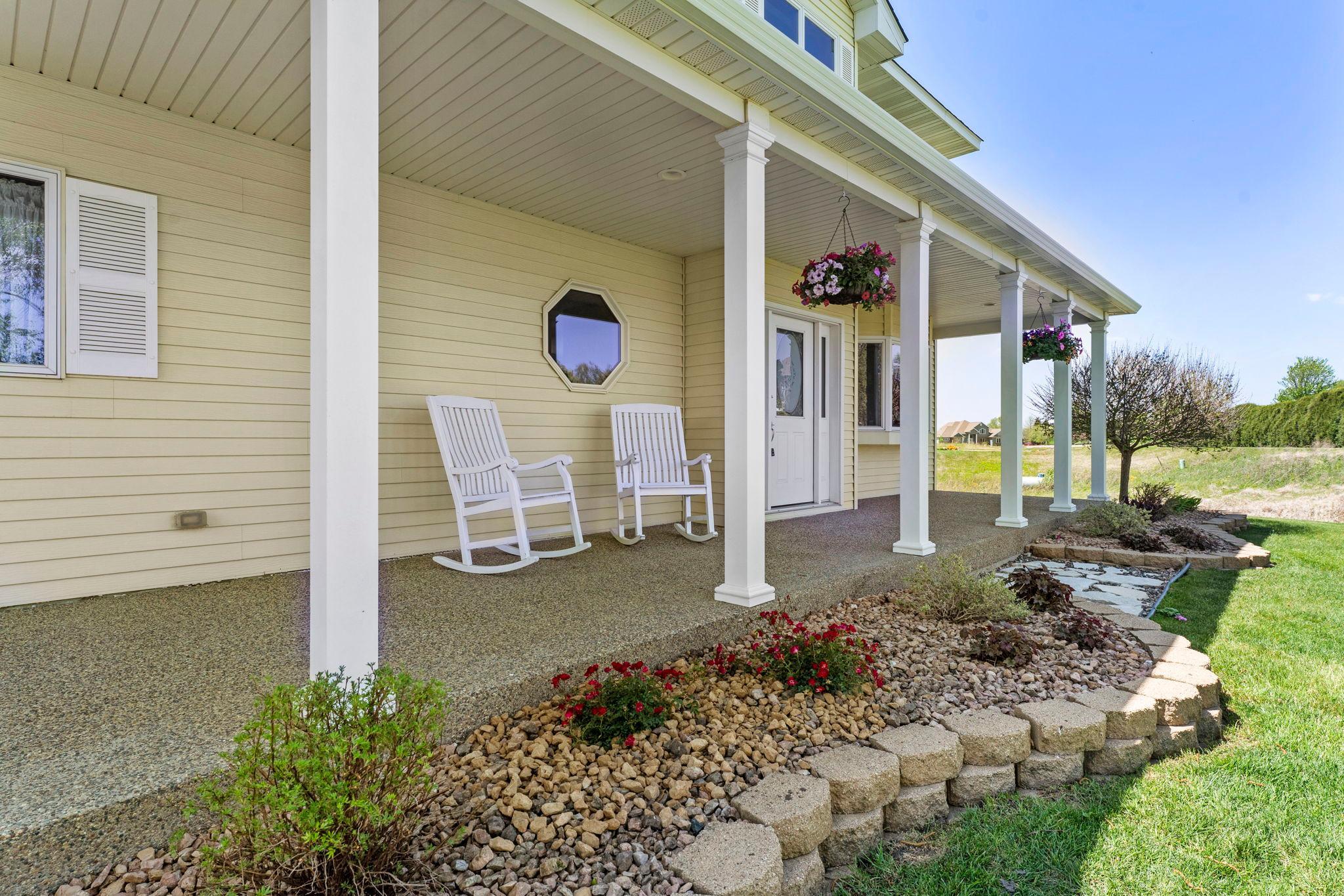 Covered and comfortable, this patio is right off the front entrance.