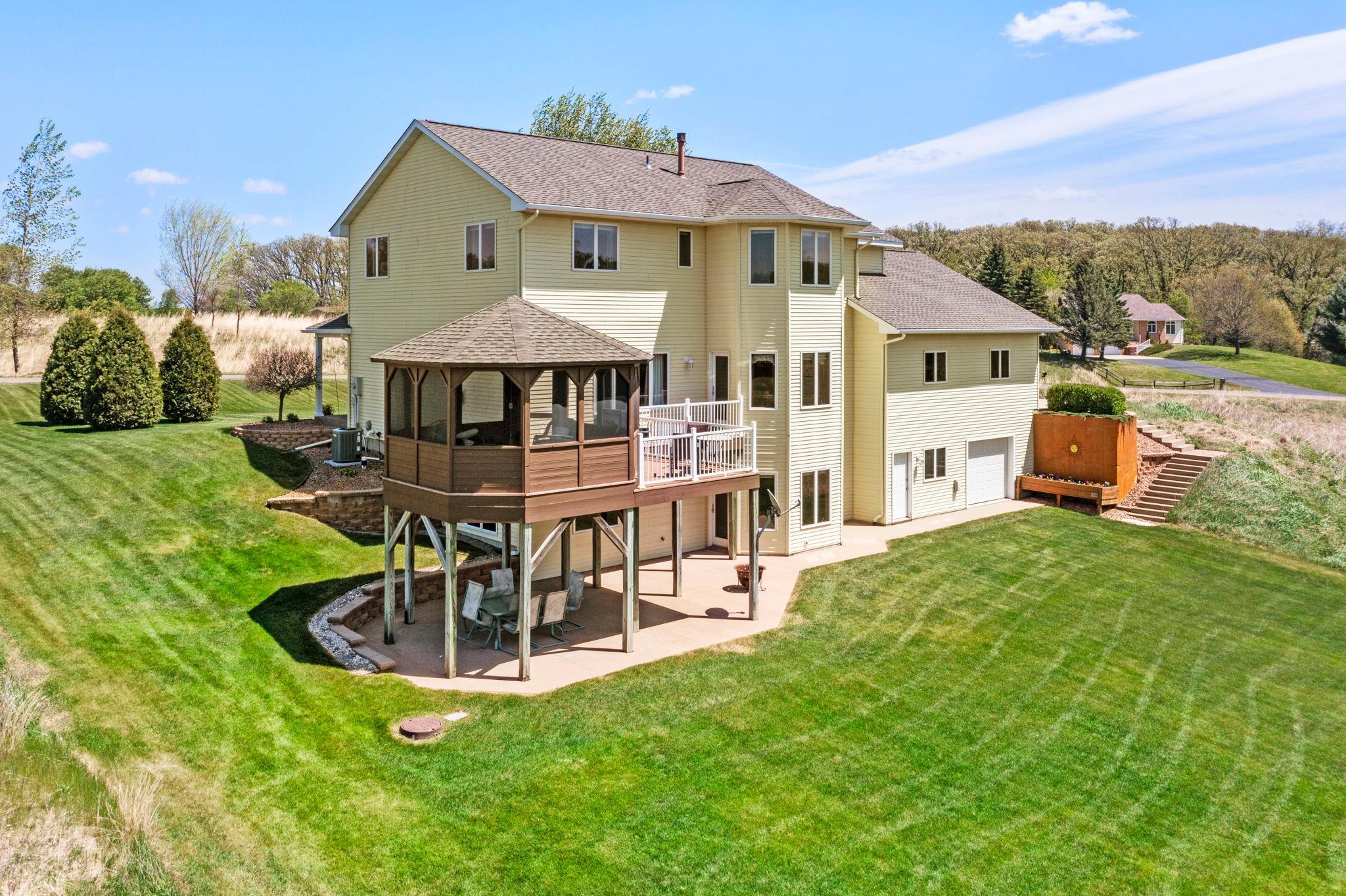 The back of the home is perfectly set up for everyday living, relaxing, and hosting.