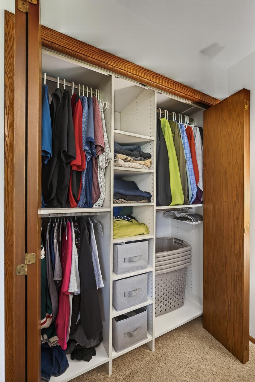 Primary bedroom closet with organizer