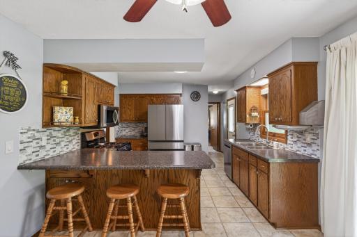 Functional kitchen peninsula with breakfast bar seating