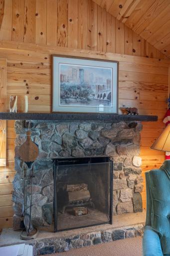 Wood burning hand stacked stone fireplace