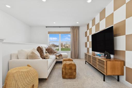 Photo is of the actual model. Located on the upper level, this perfectly sized living space has enough room for a desk, television and seating for all. Plus, it is just steps away from all the bedrooms.
